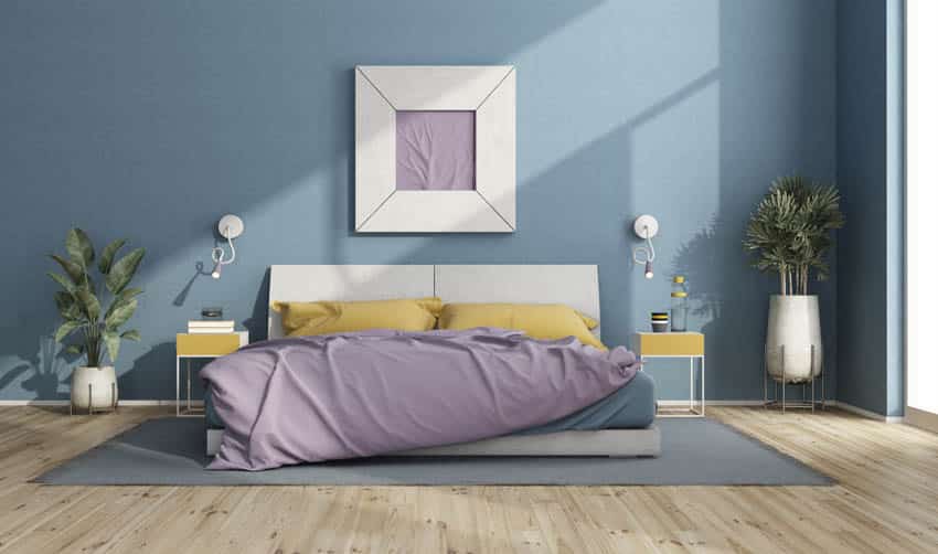 Bedroom pastel blue wall paint light wood floors indoor plants