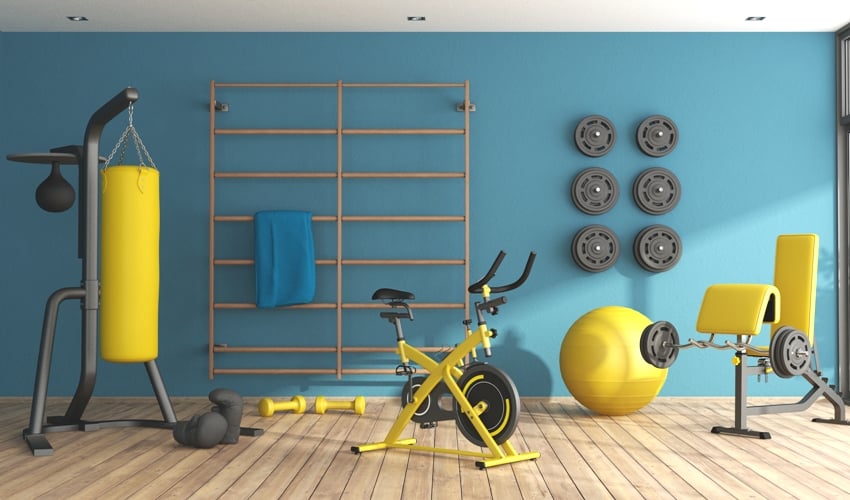 blue home gym with punching boxer bicycle and other fitness equipment