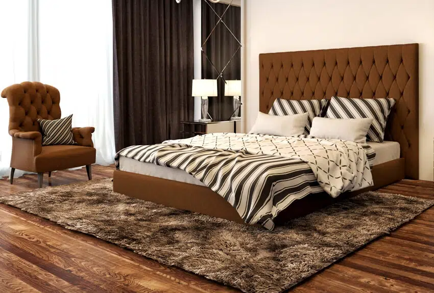 Brown bedroom interior with bed armchair and carpet