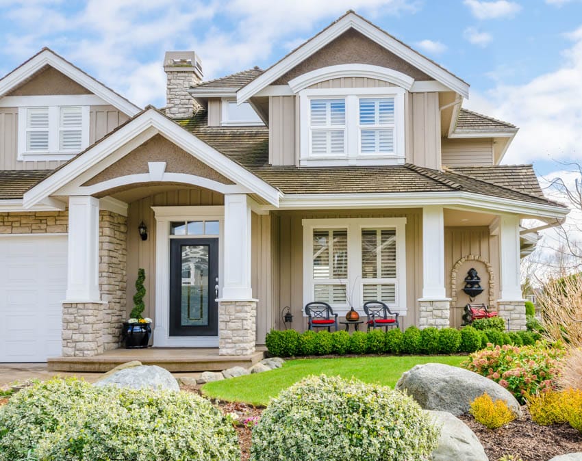 Brown house with navy blue frosted door