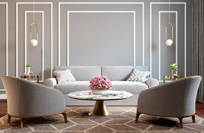 classic gray and white tones with armchairs sofa coffee table lamps flowers and wall moldings