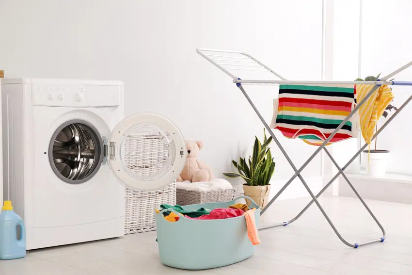 clothes drying rack laundry basket and washing machine