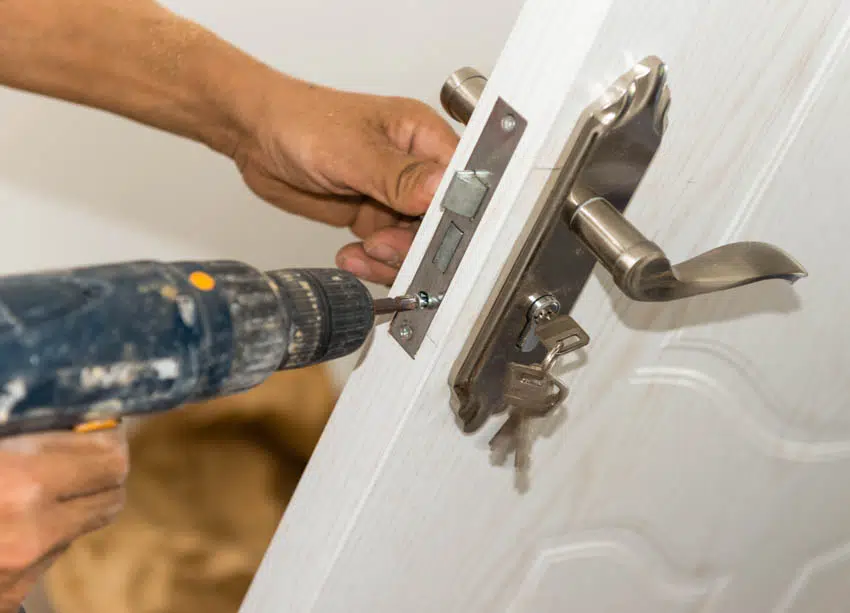 Contractor installing lock