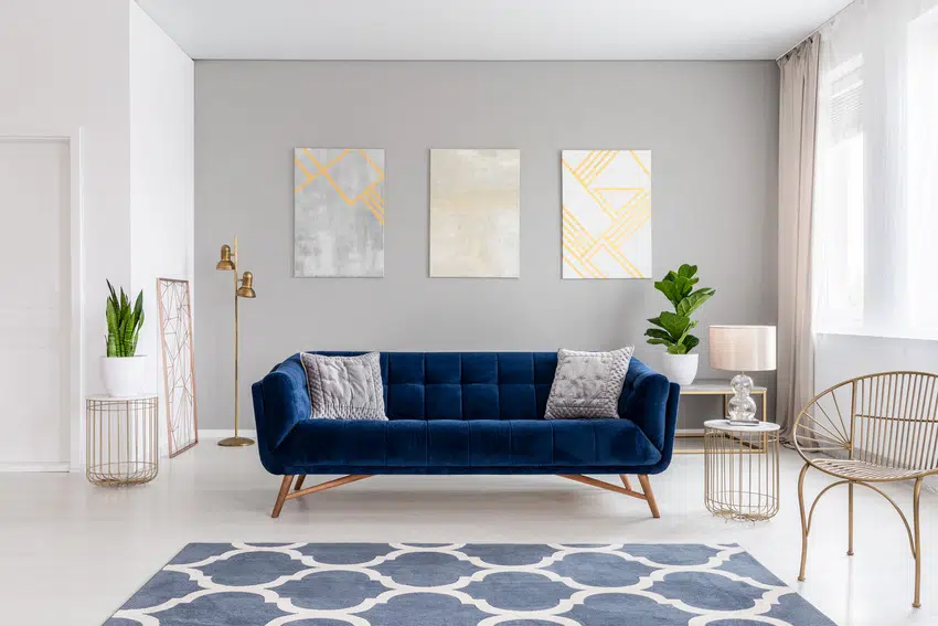 Cozy gray living room interior with blue accents 