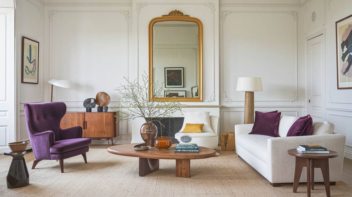 Cozy living room with purple armchair yellow mirror white sofa