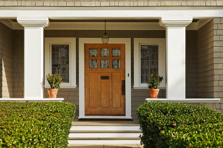 Craftsman home with wood door and glass windows