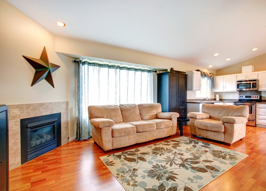 Dainty floral carpet in spacious living space with hardwood flooring