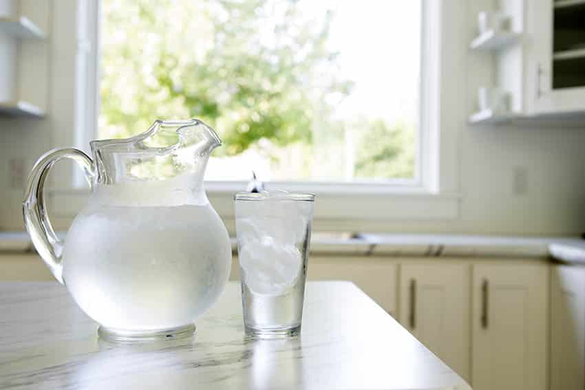 Drinking clean water in kitchen