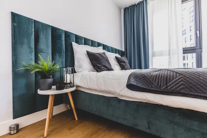 Floating bed in a cozy bedroom interior with vinyl floor 
