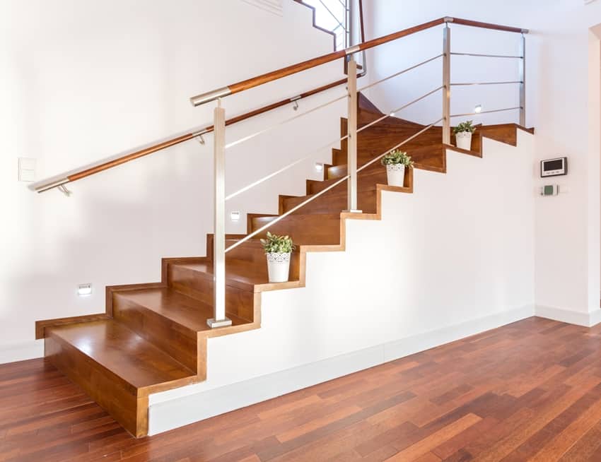 flowerpots on wooden stairs with wall