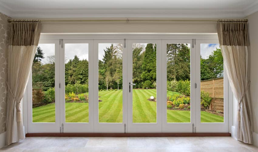 Folding door with curtains