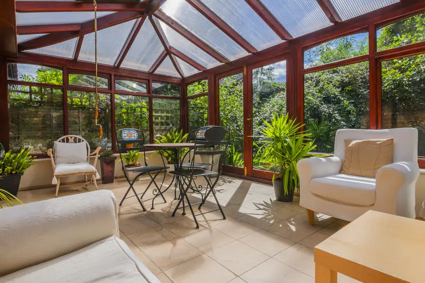 Four season sunroom with various furniture and plants