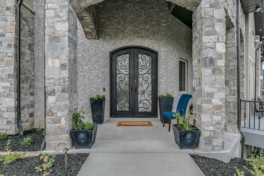 Frosted ornate door concrete masonry wall and pillar