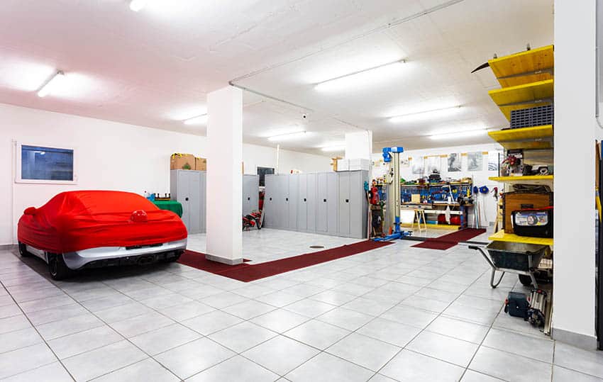 Garage with tile floors locker storage as partition wall