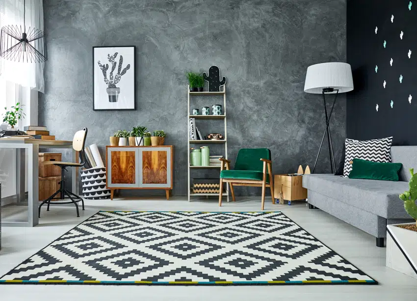 grey room with pattern carpet and wooden furniture
