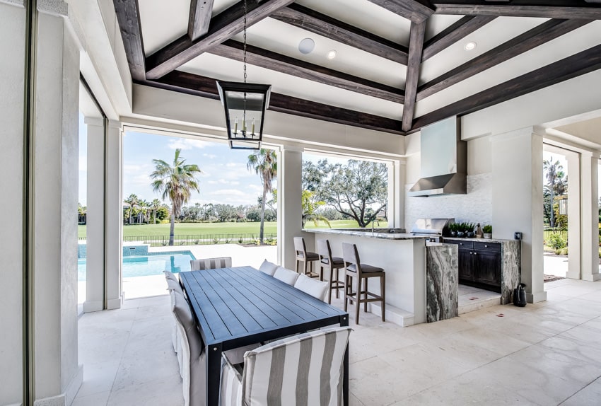 Led candle hanging from ceiling outdoor kitchen and dining area