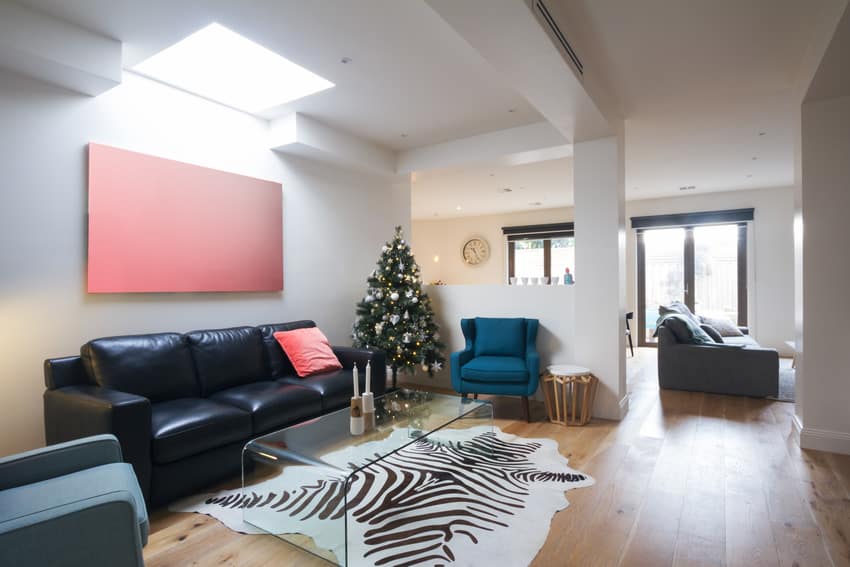 black leather couch in living space with animal print rug