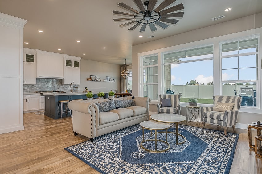 part living area part kitchen space with blue accents and medallion rug