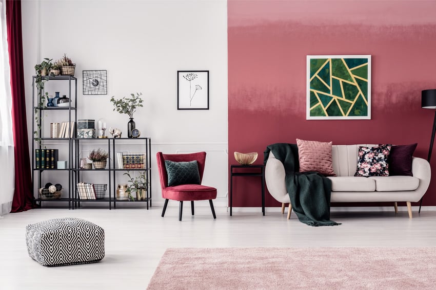 Living room interior with pink walls and red curtain