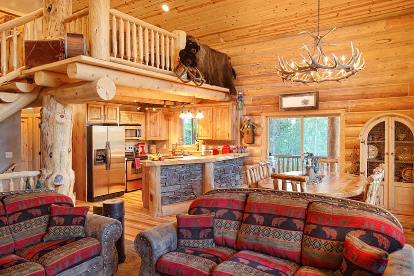 Log home living and dining room with loft