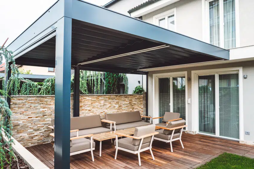 Louvered roof pergola with outdoor furniture under