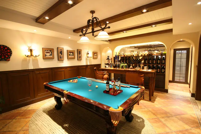 Man cave with billiards table bar coffered ceiling and wall mounted lights