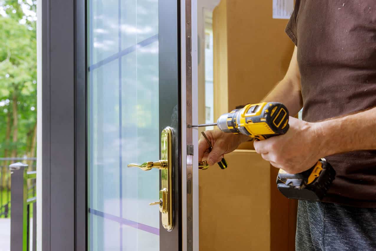 Man installing door lock