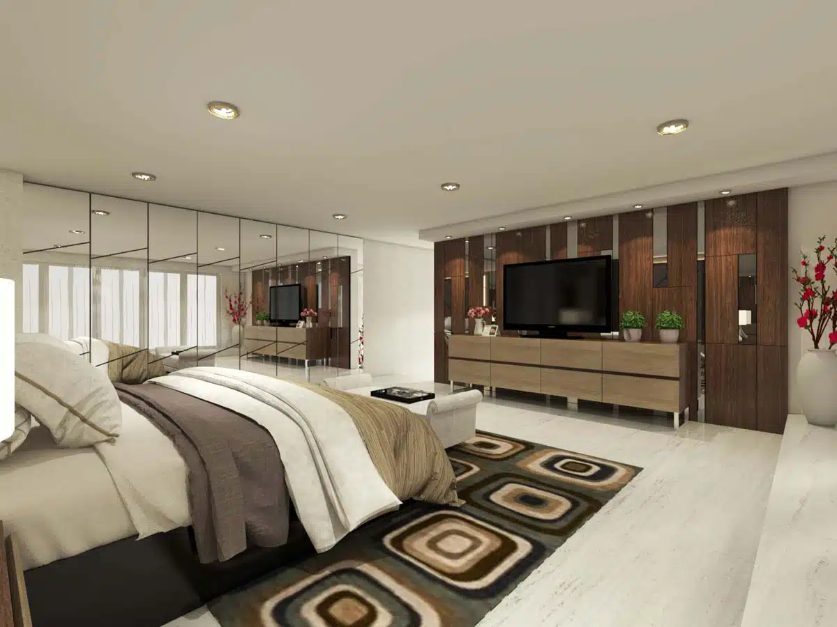 modern bedroom with television and mirrored wall