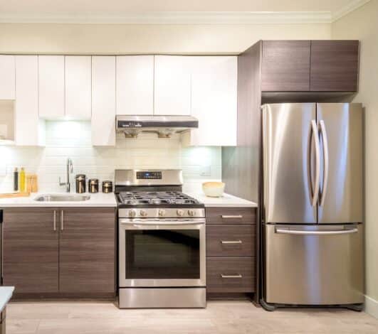 Refrigerator Next to Stove in Kitchen