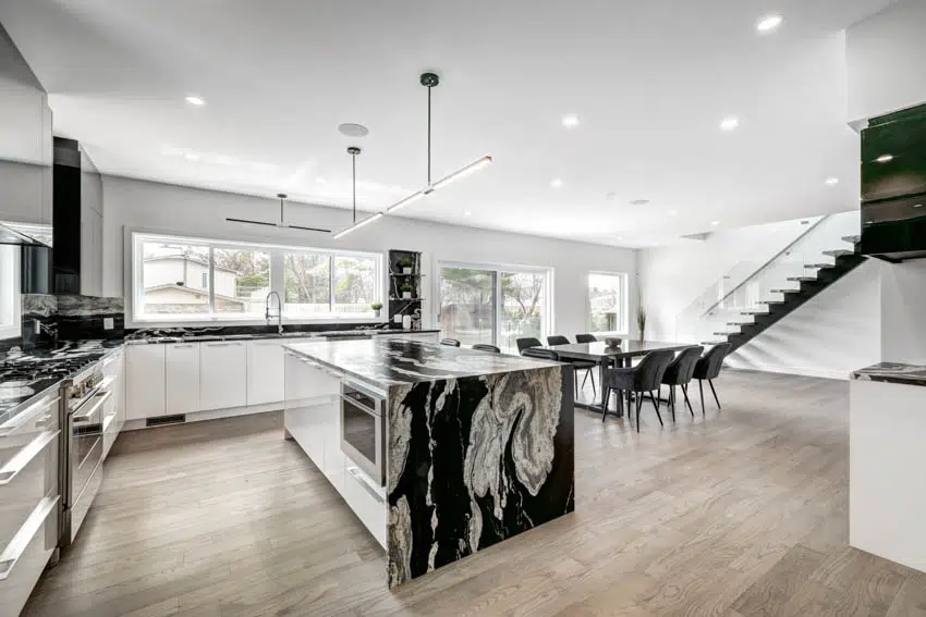 Modern kitchen with marble center island wood floor