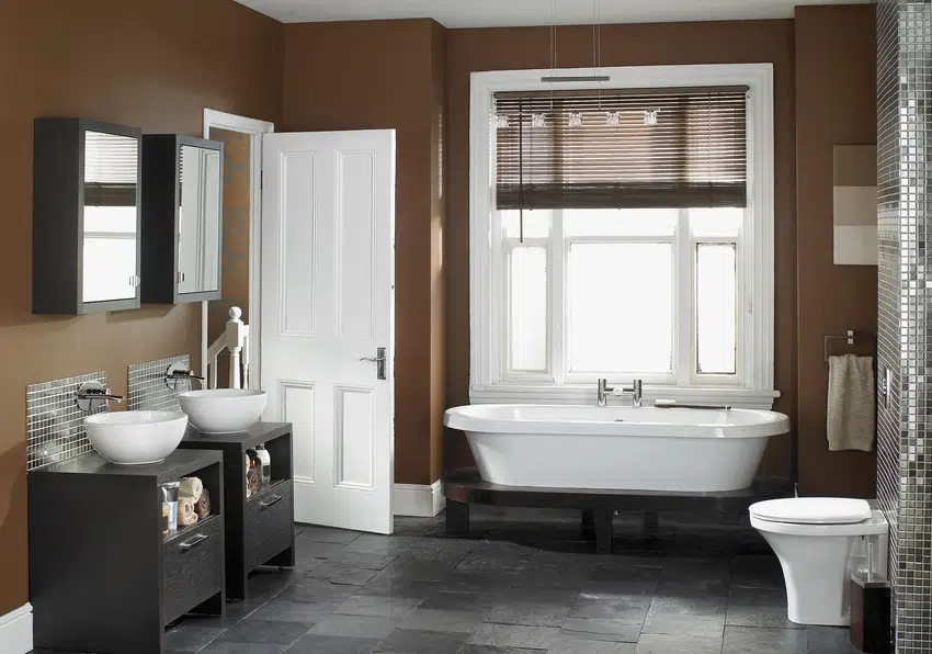 Modern stylish bathroom interior with woven blinds bathtub and sink