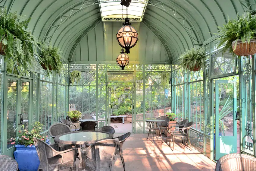 Modern stylish sunroom with furniture plants and light fixtures