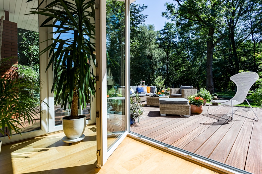 Outdoor area with small deck and cozy furniture pieces