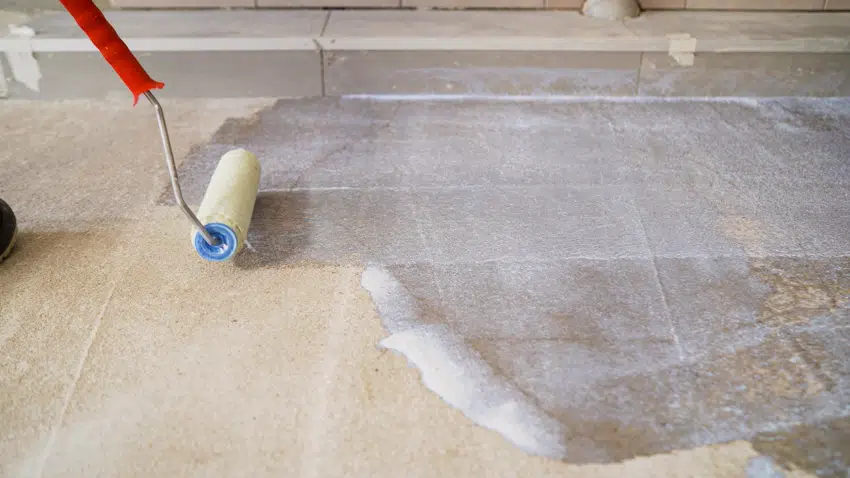 Priming concrete tile floors for epoxy coating