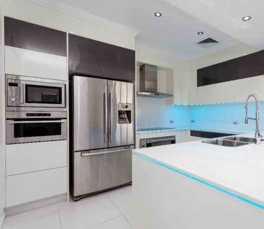 Refrigerator Next to Stove in Kitchen