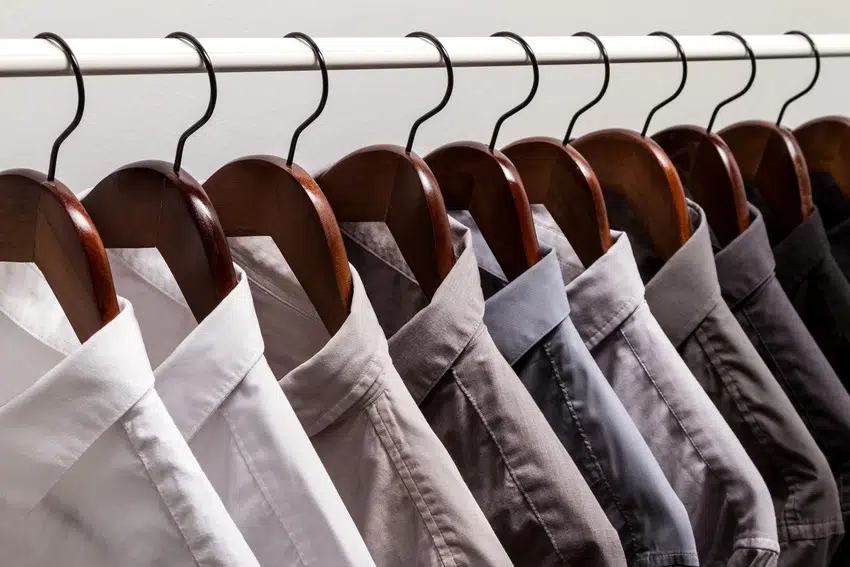 Row of shirts hanging in a closet