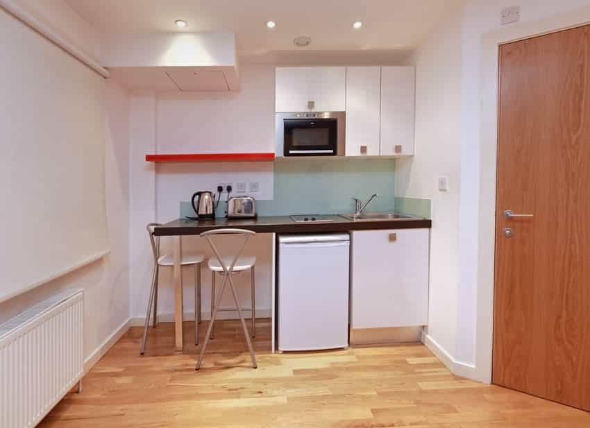 Small kitchen booth wood floors and door