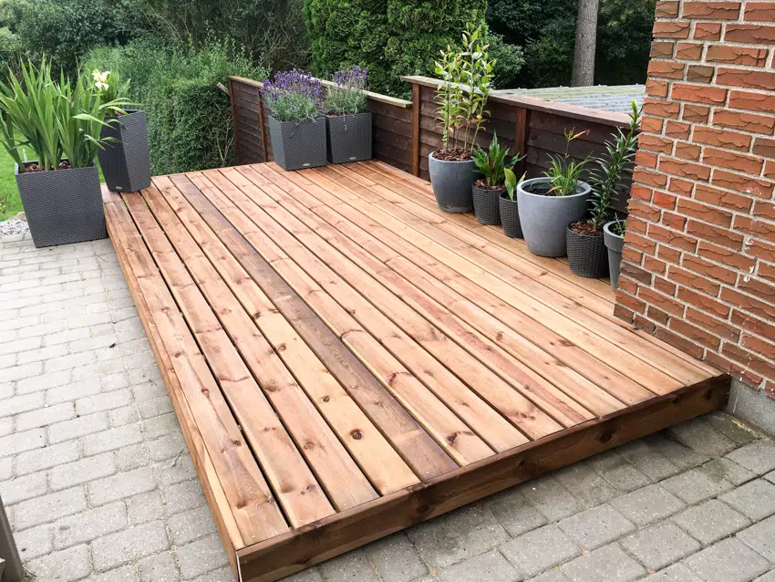 Small wooden deck on concrete
