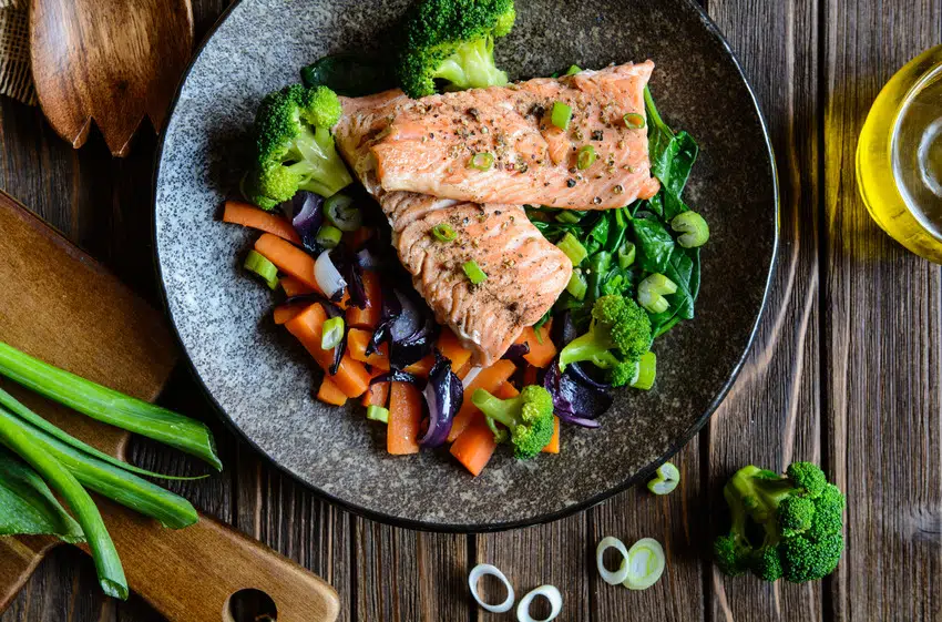 Steamed vegetables with fried salmon dish