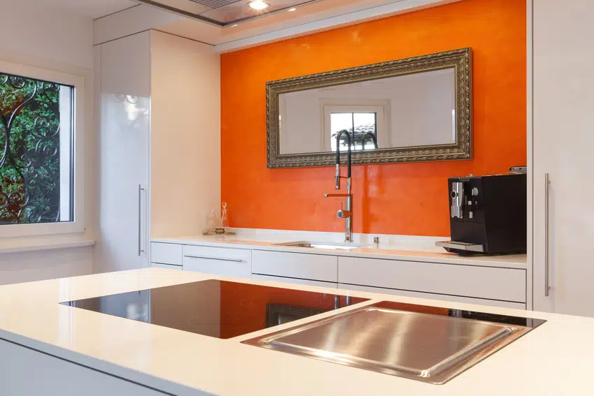 Striking orange and white kitchen interior