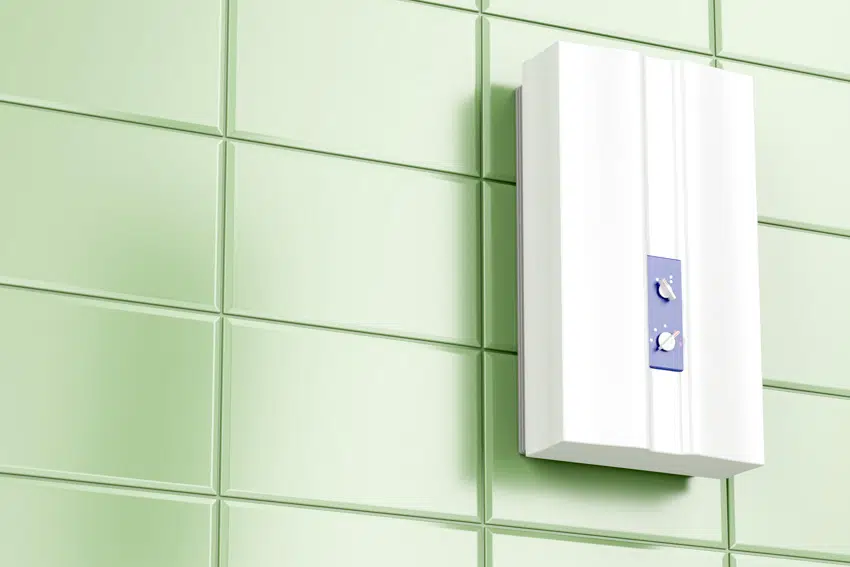 Green tiled wall with tankless fixture
