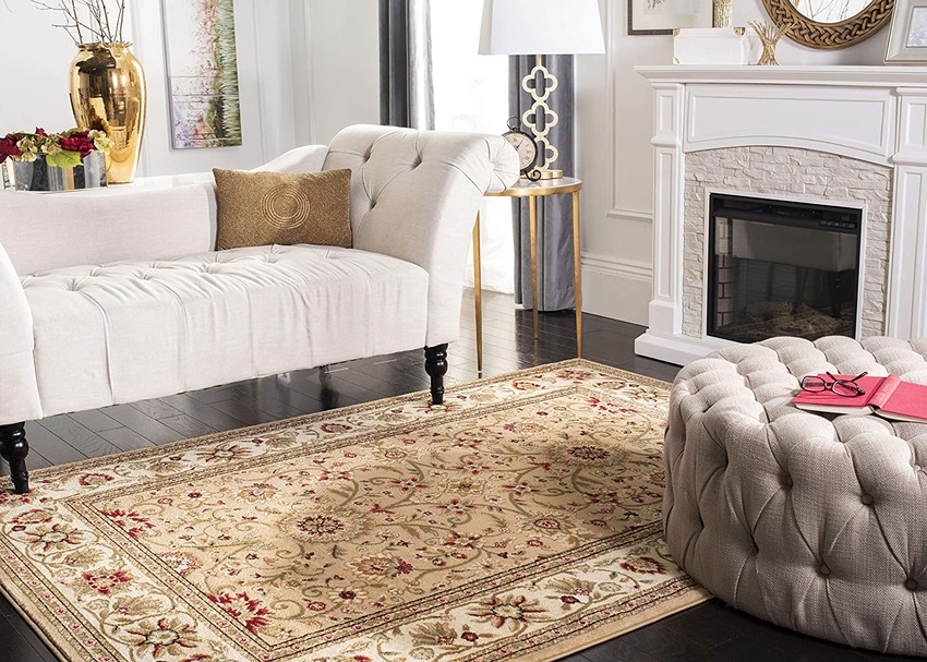 Traditional oriental rug in between couch and fireplace