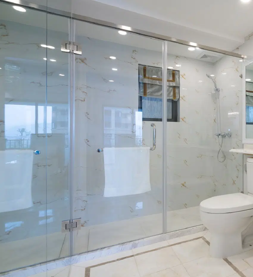 White interior bathroom with clear glass pane