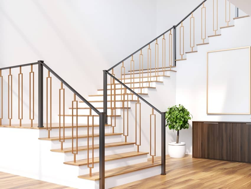 white living room interior with a staircase a chest of drawers and a potted tree