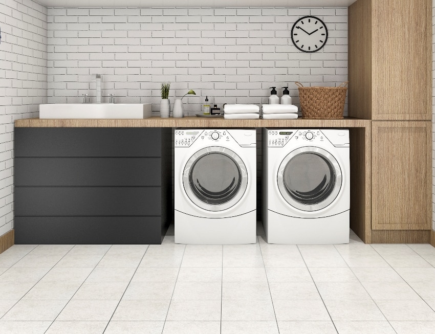 Laundry room with tile floors and subway tile