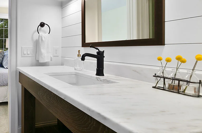 Bathroom sink with single handle faucet marble countertop is
