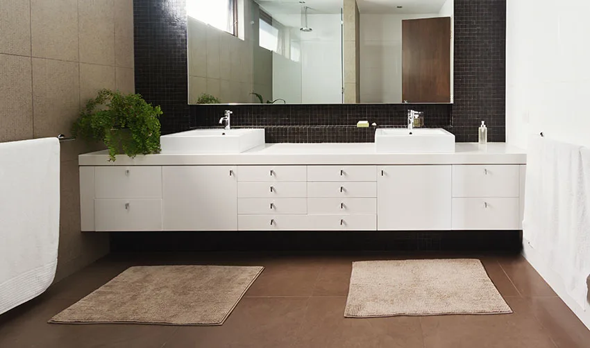 Double basin white vanity with rug large mirror is