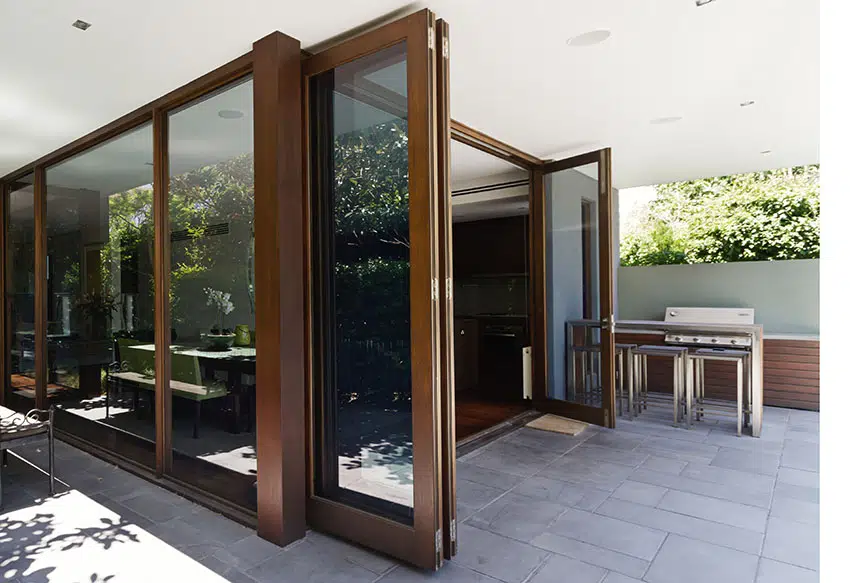 Big bi-fold doors with wooden frame picture window