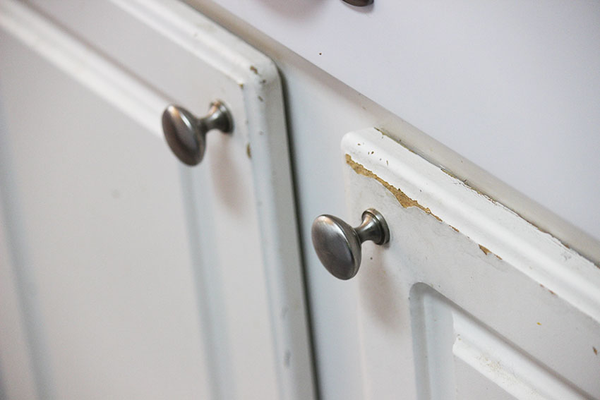 Cabinet door with worn spot and mushroom pull