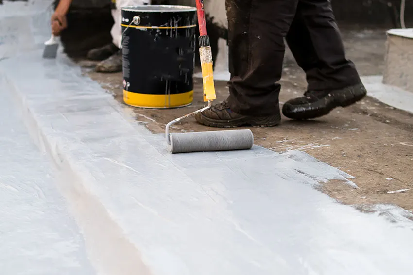 Applying silicone roof coating using roller brush